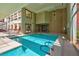 Beautiful indoor pool featuring large windows and elegant architectural details at 75 E Agate Ave # 206, Las Vegas, NV 89123