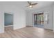 Open living space with modern ceiling fan and sliding glass door to balcony at 75 E Agate Ave # 206, Las Vegas, NV 89123