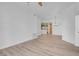 Bright living room with white walls and modern light wood-look floors at 75 E Agate Ave # 206, Las Vegas, NV 89123
