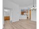 Open floor plan: Living room view to the kitchen and bathroom at 75 E Agate Ave # 206, Las Vegas, NV 89123
