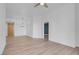 Bright living room with modern light fixture and light wood-look floors at 75 E Agate Ave # 206, Las Vegas, NV 89123