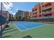 Well-maintained tennis court surrounded by lush greenery and vibrant community buildings at 75 E Agate Ave # 206, Las Vegas, NV 89123