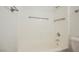 Clean bathroom featuring a bathtub and shower with grab bars at 7754 Pink Ginger St, Las Vegas, NV 89123