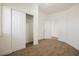 Comfortable bedroom with carpet, closet, and an attached bathroom at 7754 Pink Ginger St, Las Vegas, NV 89123