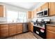 Modern kitchen boasts stainless steel appliances, ample storage, and granite countertops at 7754 Pink Ginger St, Las Vegas, NV 89123