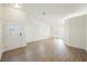 Open-concept living area features wood floors and great natural light at 7754 Pink Ginger St, Las Vegas, NV 89123