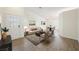 Bright living room boasts stylish furnishings, wood floors, and ample natural light at 7754 Pink Ginger St, Las Vegas, NV 89123