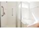 Walk-in shower and soaking tub in a bright main bathroom at 7754 Pink Ginger St, Las Vegas, NV 89123