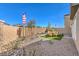 Enclosed backyard with desert landscaping and patio dining area, perfect for outdoor relaxation at 790 Calm Crystal Ct # Lot 140, North Las Vegas, NV 89081