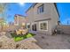 Backyard features desert landscaping, artificial turf, and a patio dining area, ideal for entertaining at 790 Calm Crystal Ct # Lot 140, North Las Vegas, NV 89081