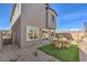 Enclosed backyard with desert landscaping, artificial turf, and patio dining area at 790 Calm Crystal Ct # Lot 140, North Las Vegas, NV 89081