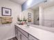 Modern bathroom features a large mirror, vanity with storage, and tiled shower at 790 Calm Crystal Ct # Lot 140, North Las Vegas, NV 89081