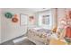 Bright bedroom featuring stylish decor, a comfortable bed, and natural light from the window at 790 Calm Crystal Ct # Lot 140, North Las Vegas, NV 89081