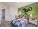 Stylish bedroom features a cool BMX theme, study desk, and plenty of space at 790 Calm Crystal Ct # Lot 140, North Las Vegas, NV 89081
