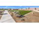 Well-maintained community area with green space, landscaping, walking path, and seating at 790 Calm Crystal Ct # Lot 140, North Las Vegas, NV 89081