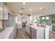 Open kitchen has stainless appliances, island with seating, and ample storage space at 790 Calm Crystal Ct # Lot 140, North Las Vegas, NV 89081