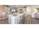 Modern kitchen features an island with seating, stainless steel appliances, and ample cabinetry at 790 Calm Crystal Ct # Lot 140, North Las Vegas, NV 89081