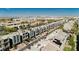 Scenic aerial view of modern townhomes in a vibrant neighborhood with lush landscaping and a beautiful city skyline at 8095 Carpenter Creek Ave, Las Vegas, NV 89113