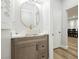 Stylish half-bath with elegant vessel sink, marble countertop, and modern fixtures at 8095 Carpenter Creek Ave, Las Vegas, NV 89113