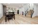 Open-concept living space with wood floors and a modern kitchen at 8095 Carpenter Creek Ave, Las Vegas, NV 89113