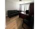 Office space with a desk, sofa, and natural light from shuttered windows at 8095 Carpenter Creek Ave, Las Vegas, NV 89113