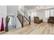 Modern staircase with metal railing in open concept living room at 8095 Carpenter Creek Ave, Las Vegas, NV 89113