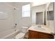 Clean bathroom featuring a shower-tub, a toilet, and a vanity with solid surface countertop at 8152 Satin Carnation Ln, Las Vegas, NV 89166
