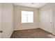 Comfortable bedroom with carpet, a window with blinds, and a closet with sliding doors at 8152 Satin Carnation Ln, Las Vegas, NV 89166
