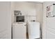 Efficient laundry room featuring a washing machine and a dryer in a compact space at 8152 Satin Carnation Ln, Las Vegas, NV 89166