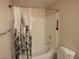 Bathroom with white bathtub, patterned shower curtain, and tiled walls at 9000 Las Vegas Blvd # 1250, Las Vegas, NV 89123