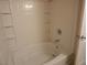 White bathtub with tiled walls and built-in shelves at 9000 Las Vegas Blvd # 1250, Las Vegas, NV 89123