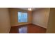 An empty bedroom featuring wood flooring and a window, offering a bright and airy space at 9000 Las Vegas Blvd # 1250, Las Vegas, NV 89123