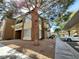 Exterior view of the townhome with gravel landscaping, large windows, and assigned covered parking at 9000 Las Vegas Blvd # 1250, Las Vegas, NV 89123