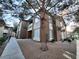 Low angle exterior view of the townhome featuring gravel landscaping and well-maintained surroundings at 9000 Las Vegas Blvd # 1250, Las Vegas, NV 89123