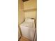 Bright laundry room features a white washing machine and convenient overhead shelf for storage solutions at 9000 Las Vegas Blvd # 1250, Las Vegas, NV 89123