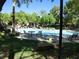 Community pool area featuring tables, lounge chairs, and lush landscaping at 9000 Las Vegas Blvd # 1250, Las Vegas, NV 89123