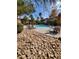 Community pool surrounded by lounge chairs and desert landscaping on a sunny day at 9000 Las Vegas Blvd # 1250, Las Vegas, NV 89123