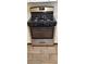 Stainless steel and black gas stove with a four-burner cooktop and tile flooring in the kitchen at 9000 Las Vegas Blvd # 1250, Las Vegas, NV 89123