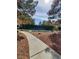 Beautiful tennis court surrounded by lush greenery and mature trees, perfect for active residents at 9000 Las Vegas Blvd # 1250, Las Vegas, NV 89123