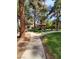 Picturesque walkway through landscaped grounds leading to a covered gazebo and apartment buildings at 9000 Las Vegas Blvd # 1250, Las Vegas, NV 89123