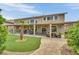 Gorgeous backyard with a covered patio, lush green lawn, and mature trees, perfect for outdoor entertaining at 9046 Barium Rock Ave, Las Vegas, NV 89143