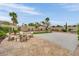 Expansive backyard with a stone patio, basketball court, and lush landscaping offering versatile outdoor living spaces at 9046 Barium Rock Ave, Las Vegas, NV 89143
