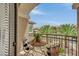 Charming balcony with seating and decorative plants overlooking the neighborhood is a peaceful outdoor retreat at 9046 Barium Rock Ave, Las Vegas, NV 89143
