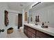 Bright bathroom with a single sink, modern fixtures, decorative towels, and a shower-tub combination at 9046 Barium Rock Ave, Las Vegas, NV 89143