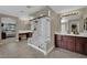 This is a large bathroom with a glass enclosed shower and double vanity at 9046 Barium Rock Ave, Las Vegas, NV 89143
