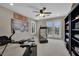 Bright exercise room featuring a ceiling fan, exercise equipment, and outdoor access at 9046 Barium Rock Ave, Las Vegas, NV 89143