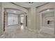 This neutral foyer has a beautiful tile floor and arched doorways at 9046 Barium Rock Ave, Las Vegas, NV 89143