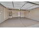 Clean and spacious garage with ample storage space and epoxy flooring, ideal for parking and projects at 9046 Barium Rock Ave, Las Vegas, NV 89143
