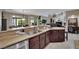 An expansive kitchen showcasing granite countertops and stainless steel appliances at 9046 Barium Rock Ave, Las Vegas, NV 89143