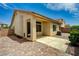 Charming backyard featuring a covered patio and brick pavers at 9137 Big Plantation Ave, Las Vegas, NV 89143